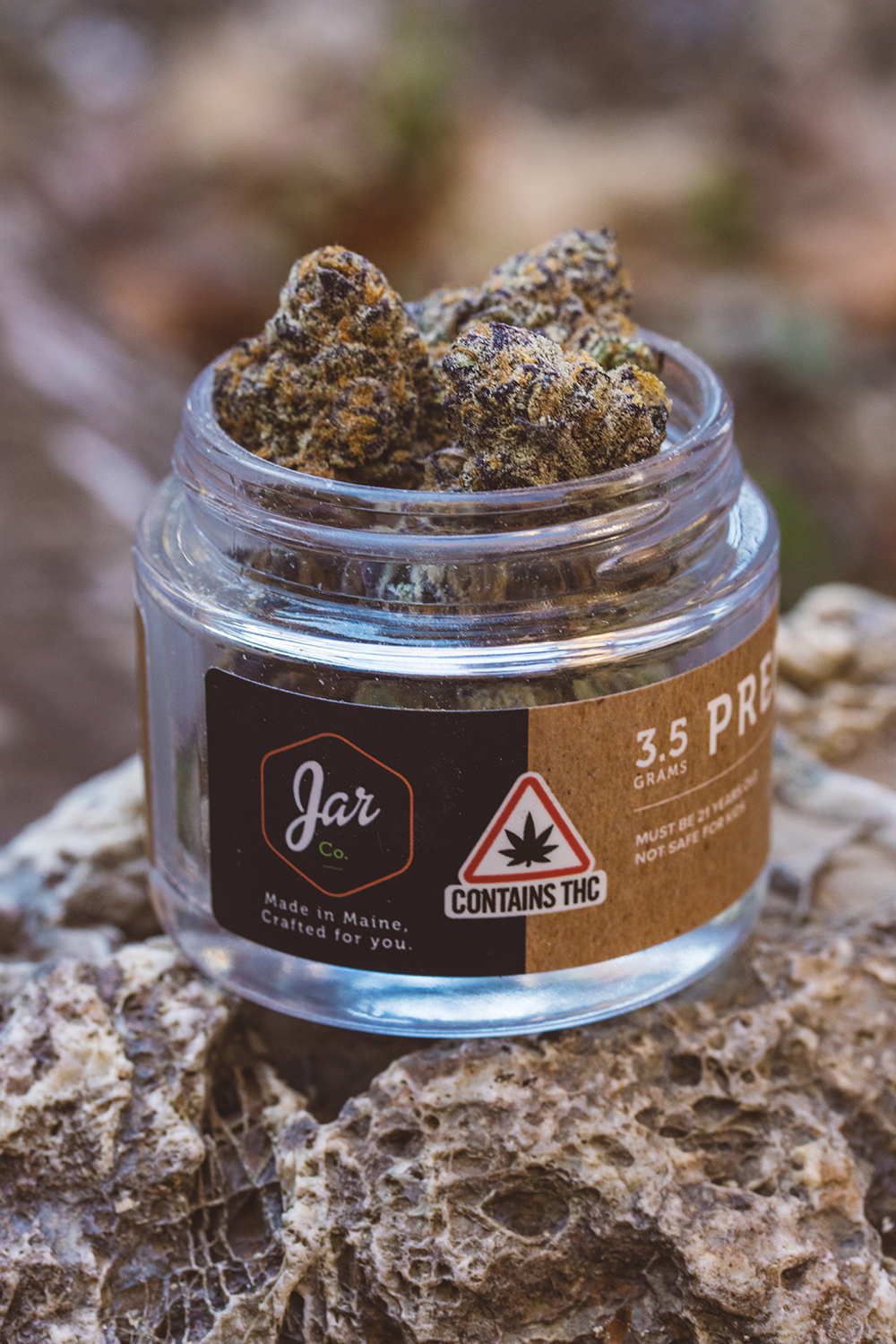 Cadillac Rainbows hybrid strain from JAR Cannabis displayed in glass jar